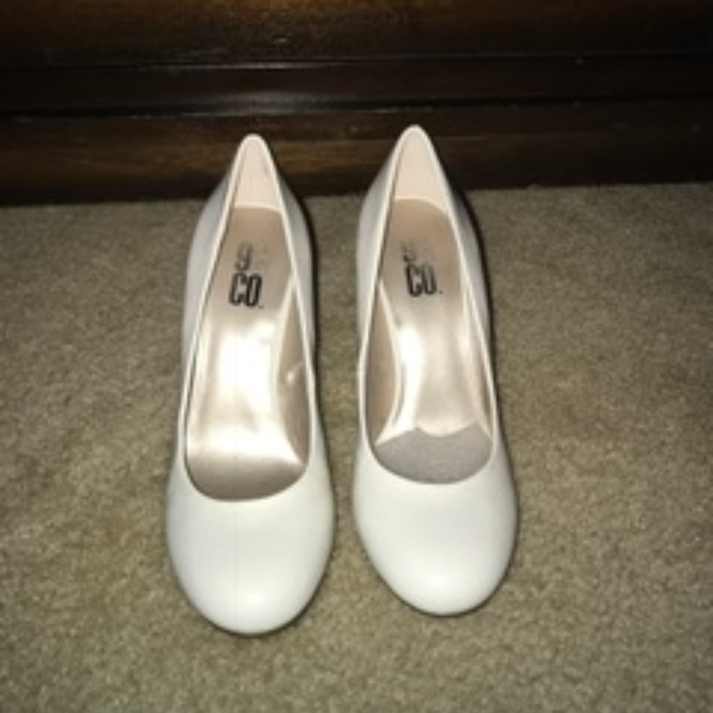 White patent leather pumps